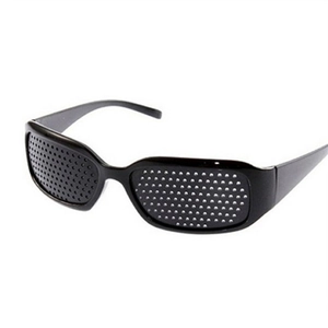 Detail view of black full-frame pinhole glasses showing precision micro-holes and frame curve