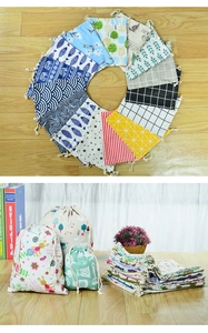 Various patterned linen drawstring bags with floral and geometric prints for storage