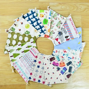 Variety of printed linen drawstring bags with patterns like polar bears and trees