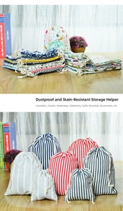 Detail showing various sizes of striped cotton linen drawstring bags for storage