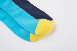 Detailed view of mid-calf socks with navy blue, sky blue, and yellow stripes