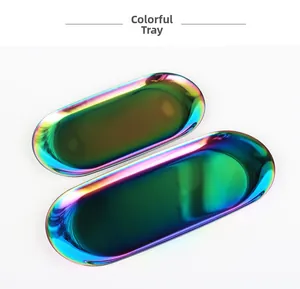 Detail showing two sizes of rainbow iridescent stainless steel oval jewelry trays
