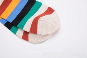 Close-up of colorful striped cotton crew socks showing fine knit texture and toe stitching