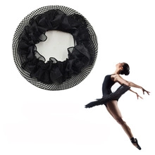 Detail of black ballet hair net bun cover with bow and mesh texture on white background