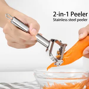 Commercial stainless steel 2-in-1 peeler and shredder used on carrots into glass bowl