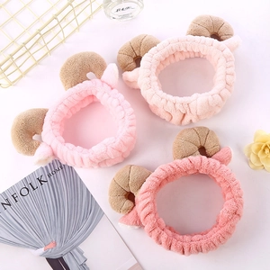 Plush cat ear headbands in three shades of pink for facial cleansing and styling