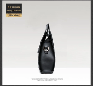Side view of black crocodile pattern handbag showing gold D-ring hardware and stitching