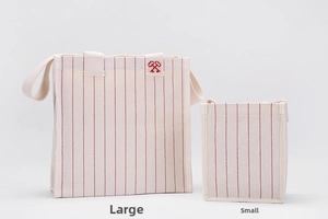 Detailed comparison of large and small striped canvas tote bags with red key embroidery