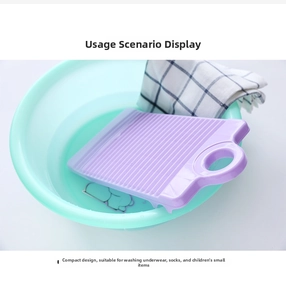 Detailed wave texture on a purple mini plastic washboard for scrubbing small laundry items