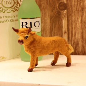 Detailed view of realistic brown reindeer figurine with soft faux fur texture and warm decor