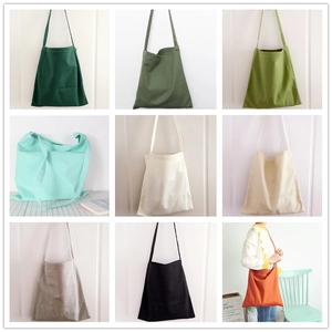 Minimalist canvas tote bags available in multiple solid colors for daily students use