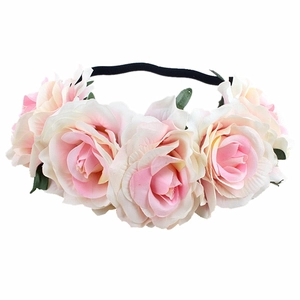 Close-up detail of realistic pink gradient roses on a bohemian floral elastic headband