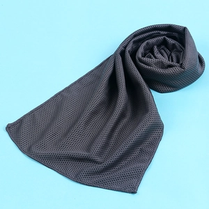 Detailed close-up of gray mesh cooling towel fabric for outdoor sports and gym workout