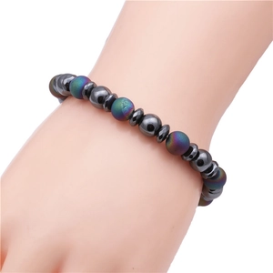 8mm hematite and colorful frosted stone beaded bracelet shown on wrist with white background