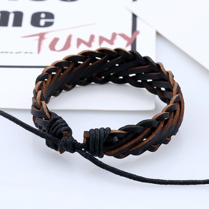 Macro shot of multi-layer woven leather bracelet in brown and black with adjustable cord