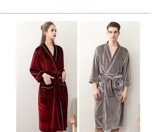 Detail of velvet bathrobes with contrast piping and waist tie in burgundy and grey