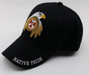 Close-up of eagle embroidery and Native Pride text on a black cotton baseball cap
