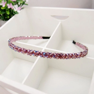 Elegant double-row purple crystal floral headband displayed in a white organizer box