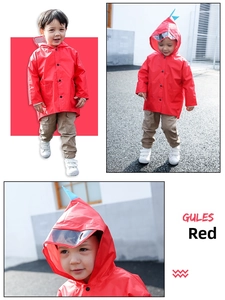 Detail of red kids raincoat featuring cartoon dinosaur hood and clear protective face shield