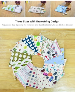 Detail of printed cotton linen drawstring bags showing various patterns and three sizes