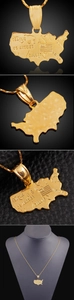 Detailed close-up of 18K gold USA map pendant with city engravings and matching chain