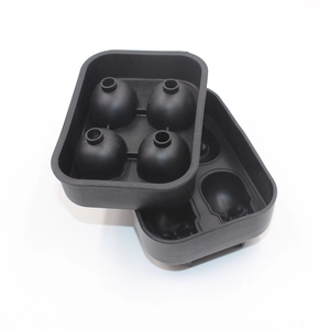 Detail view of black food-grade silicone molds for making four large spherical ice balls