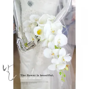 Close-up of cascading bridal bouquet with white calla lilies and orchids for a wedding