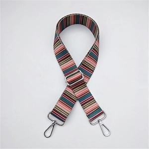 Detail of colorful woven shoulder strap with metallic silver hooks for handbags