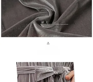 Detail of luxury grey velvet fabric texture and elegant waist tie of the long bathrobe