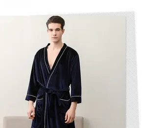 Detail of luxury navy velvet robe featuring white contrast piping and classic shawl collar