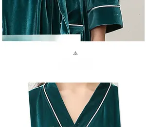 Detail of dark green velvet robe featuring a luxury texture and white piping on the V-neck