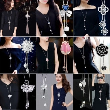 Detailed collage showing various crystal pendant necklaces including swan and clover designs