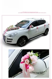 Detail of rose pink artificial Austin roses for wedding car mirror and door handle decoration