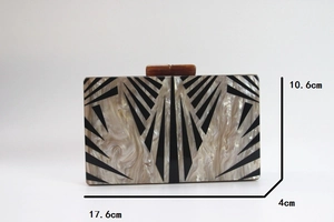 Detail showing dimensions of marble acrylic geometric clutch bag at 17.6x10.6x4cm