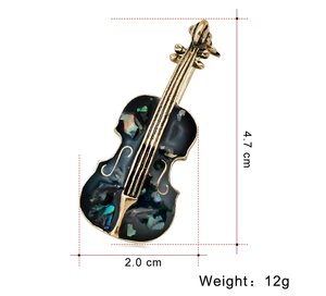 Detailed size specifications for the golden cello brooch with shell inlay 4.7cm x 2.0cm