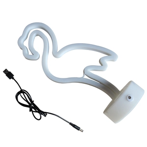 Flamingo LED neon light with white plastic base and USB cable on a white background
