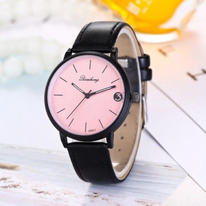 Detail of pink dial quartz watch with black leather strap and date display window