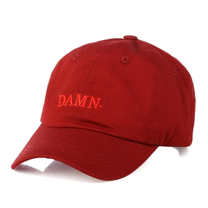 Unisex dark red cotton baseball cap with DAMN embroidery on white background