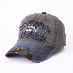 Distressed grey baseball cap with blue brim and original embroidered patch