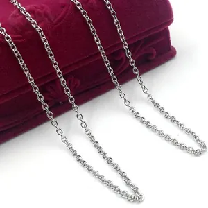 Double-sided layered cross urn necklace with crystals on red velvet jewelry box