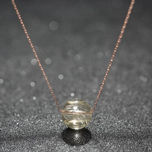 Golden rutilated quartz crystal pendant on rose gold stainless steel chain necklace