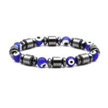 Close-up of elastic bracelet with blue evil eye beads and hematite spacer beads