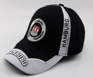 Macro detail of 3D Hamburg city embroidery and crest on black baseball cap cotton fabric