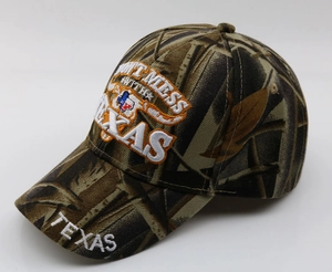Detail of 3D embroidery showing Texas silhouette and slogan on camouflage baseball cap