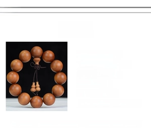 Macro detail of 2.0cm Barbie Sandalwood beads showing natural dark reddish wood grain texture