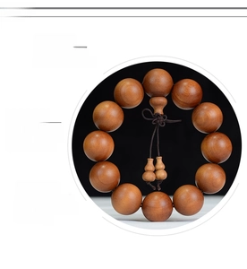 Macro detail of high-density natural sandalwood beads with clear wood grain texture