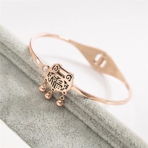 Bracelet jonc en acier titane or rose avec pendentif Fu et petites cloches
