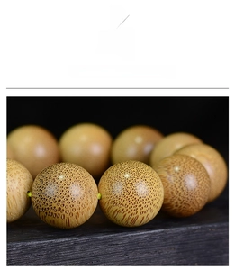 Macro shot of Dragon Blood Bamboo beads showing dense grain and natural texture