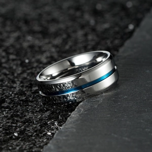 Minimalist silver stainless steel ring for men featuring a thin blue groove detail