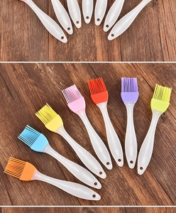 Macro detail of silicone oil brushes showing hanging holes and seven vibrant colors